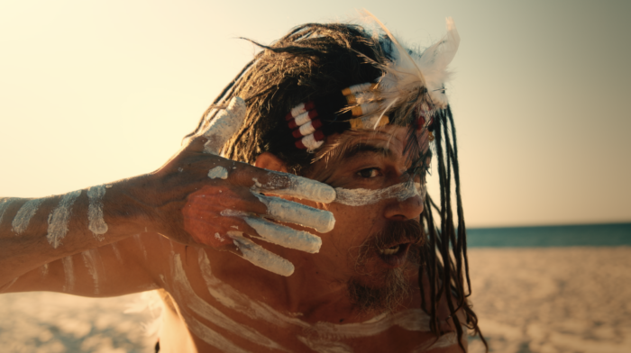 Brisbane-based Peachy Keen Colourist Angela Cerasi colour graded this shot of Aboriginal man adorning himself with face paint, on the beach, for the award-winning "Quandamooka Country" TVC for Redlands Tourism