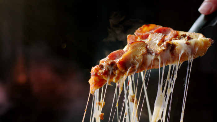 Brisbane colourist Angela Cerasi colour graded this Dominos TVC "More Smokehouse Meats" for director Ronald Koetzier, showing a meatlovers pizza slice being pulled away, cheese stretching, against a dark background