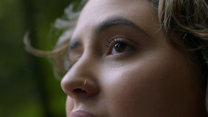 Tourism TVC colourist Angela Cersai colour graded this extreme close up shot of a woman with a gold nose ring looking into the distance, for the TEQ commercial campaign "Days Like This"